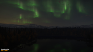 Showcasing the Northern Lights appearing across the twilight skies of Revontuli Coast.